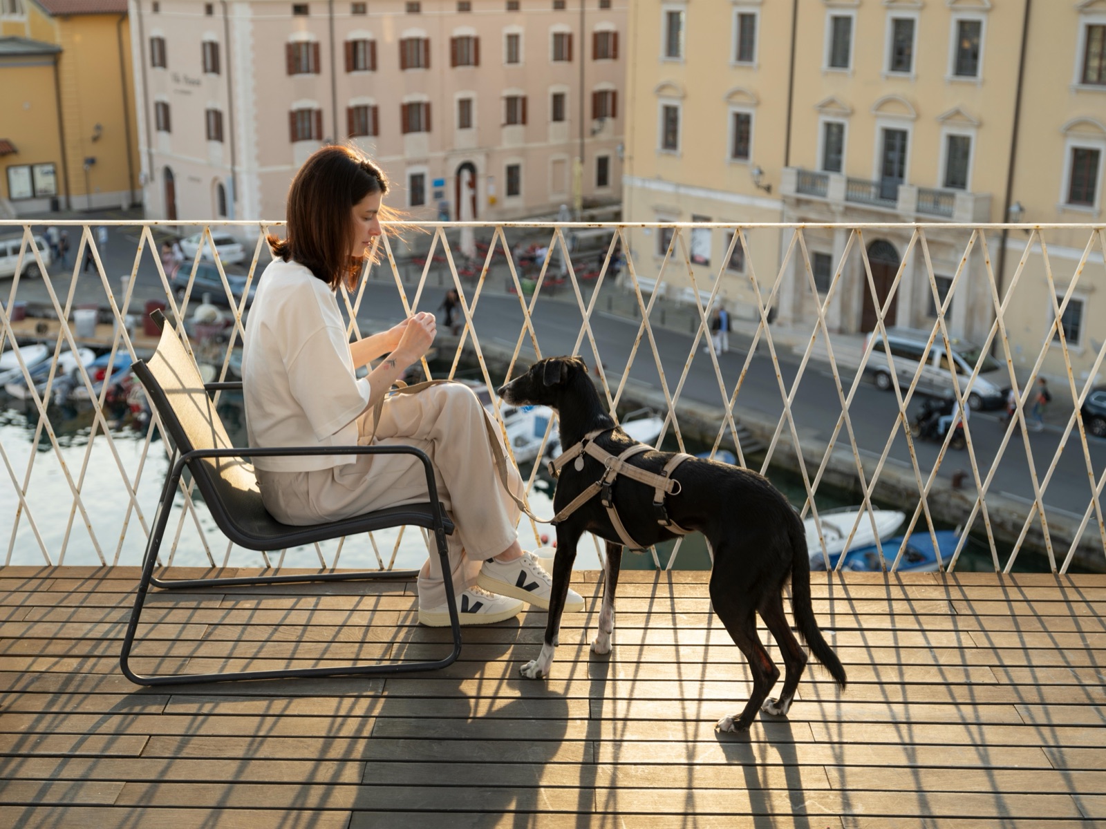 The Tartini Rooftop terrace overlooking Piran's harbour at golden hour